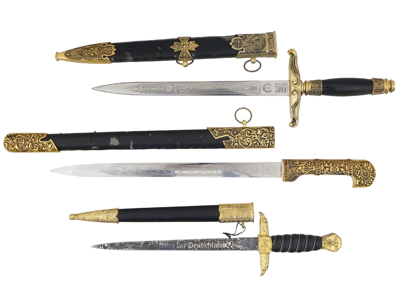 GERMAN WWII SA HONOR DAGGER AND CHINESE SWORDS: A World War II type Nazi German SA Ehrendolch, or honor dagger. The stainless steel blade is garnished with etching, the motto Alles fur Deutschland, Anything for Germany. Twisted wire grip, pommel wi