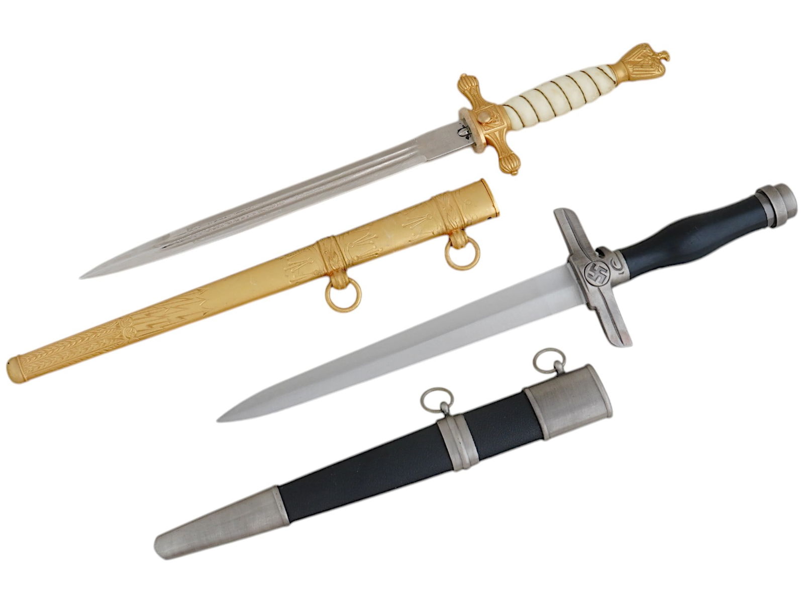WWII NAZI GERMAN KRIEGSMARINE AND POSTSCHUTZ DAGGERS: A WWII Nazi German Kriegsmarine Officers dagger featuring a nickel-plated magnetic steel blade with a sharpened tip and edges. The blade is housed within a gilded bronze upper crossguard, adorned with