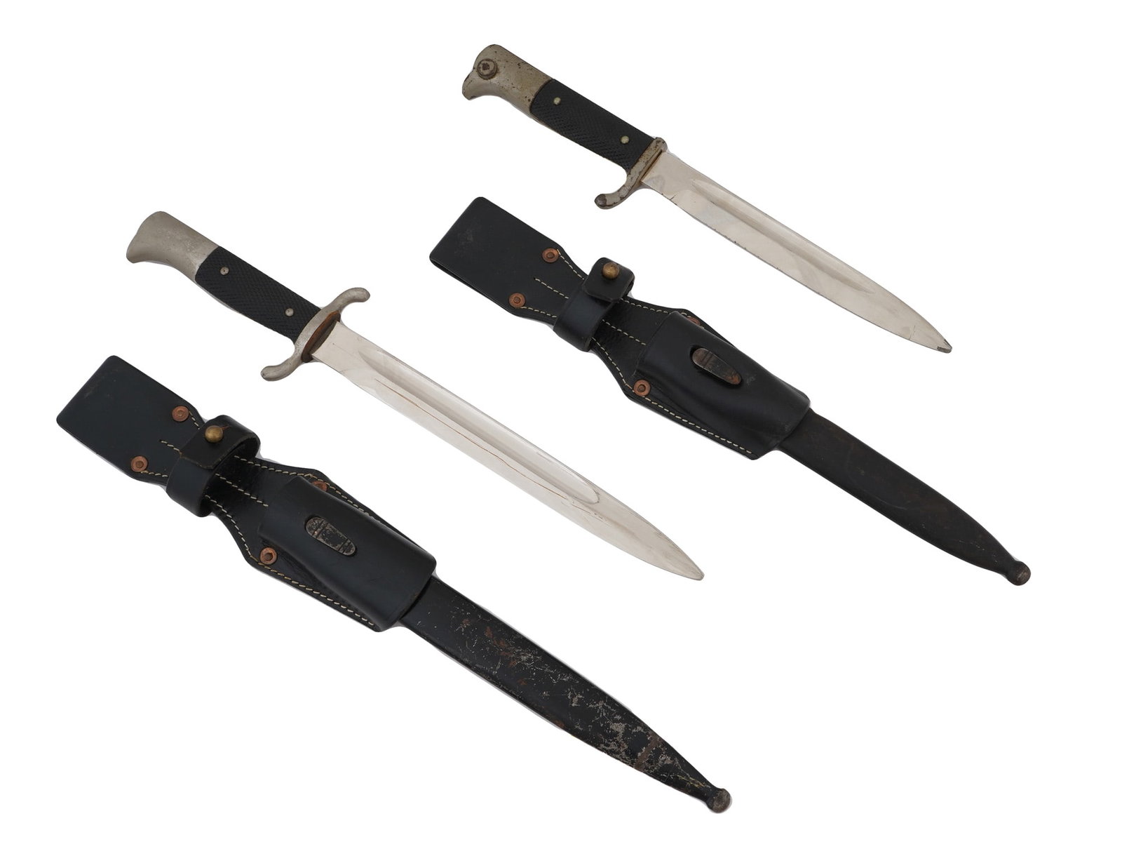 WWII GERMAN HEER AND FIRE PROTECTION POLICE BAYONETS: A WWII German Heer K98 dress bayonet featuring a polished, single-edged blade, black checkered grip panels, a nickel-plated hilt, and an upswept crossguard. Also included is a WWII Nazi German Fire Pr