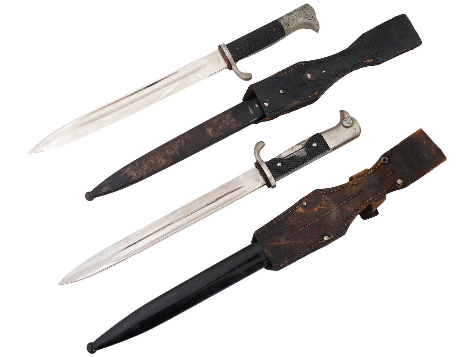 WWII NAZI GERMAN FIRE PROTECTION POLICE DRESS BAYONETS: Two WWII Nazi German Fire Protection Police dress bayonets, each featuring a nickel-plated magnetic steel blade with a fuller running along most of its length. Set within a nickel-plated alloy hilt, w