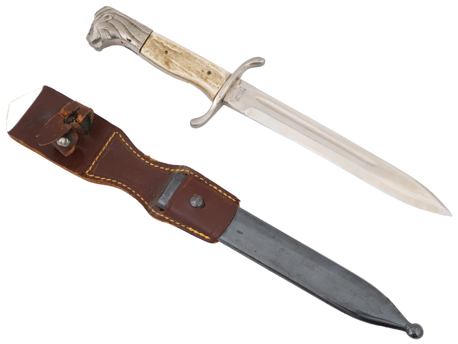 WWII SWEDISH ARMY DRESS BAYONET WITH SCABBARD: A WWII Swedish army dress bayonet featuring a nickel-plated brass bracket with a lions head design and grip plates made from elk horn. Marked F.M. Mattson Mora of Sweden to the blade. Manufactured fro