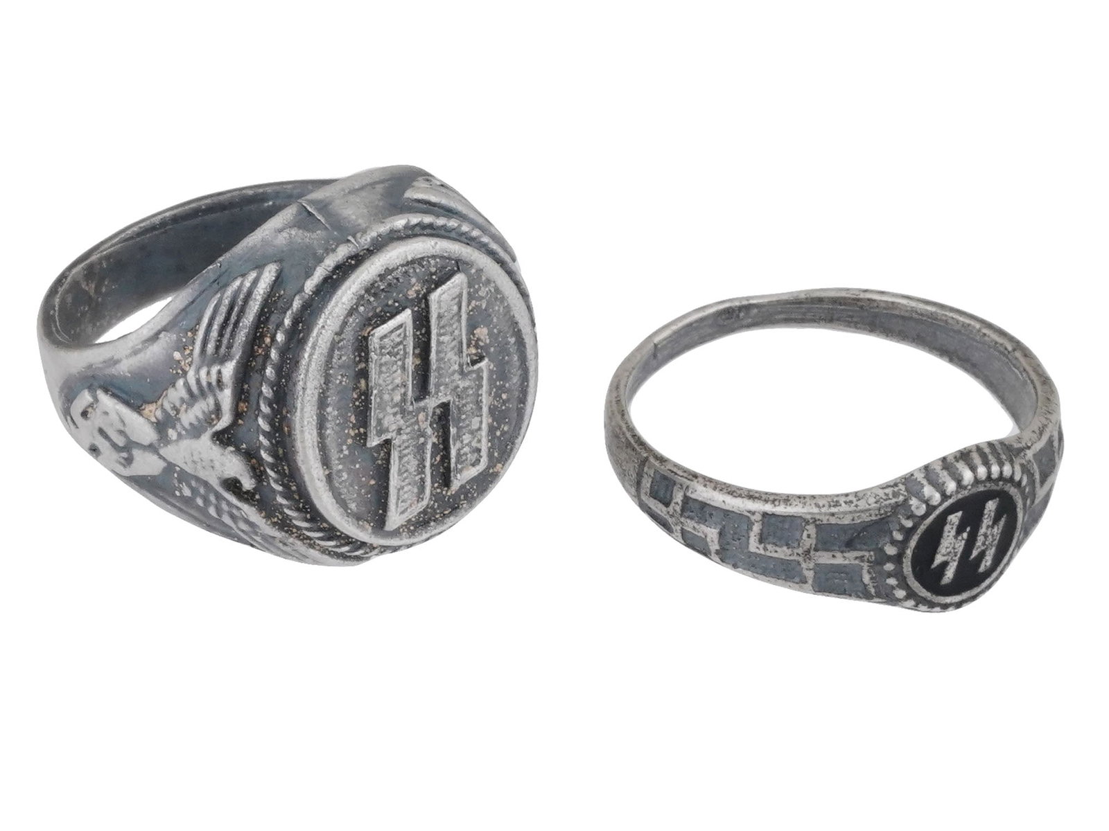 TWO WWII NAZI GERMAN WAFFEN SS SILVER RINGS: A group of two WWII Nazi German Waffen SS silver rings, each adorned with SS runes. These rings are crafted in silver and feature prominent engravings of the double lightning bolt insignia associated 