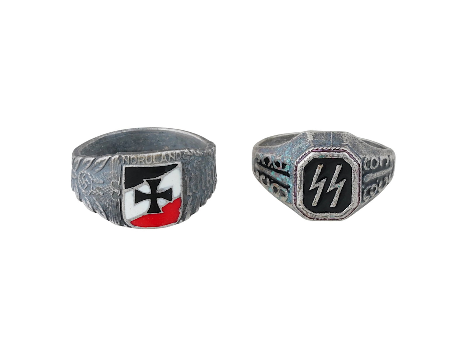 TWO WWII NAZI GERMAN WAFFEN SS SILVER RINGS: A group of two WWII Nazi German Waffen SS silver rings, one featuring the SS runes and the other representing the Waffen SS Division Wiking. Both rings are emblematic of Nazi paramilitary identity, wi