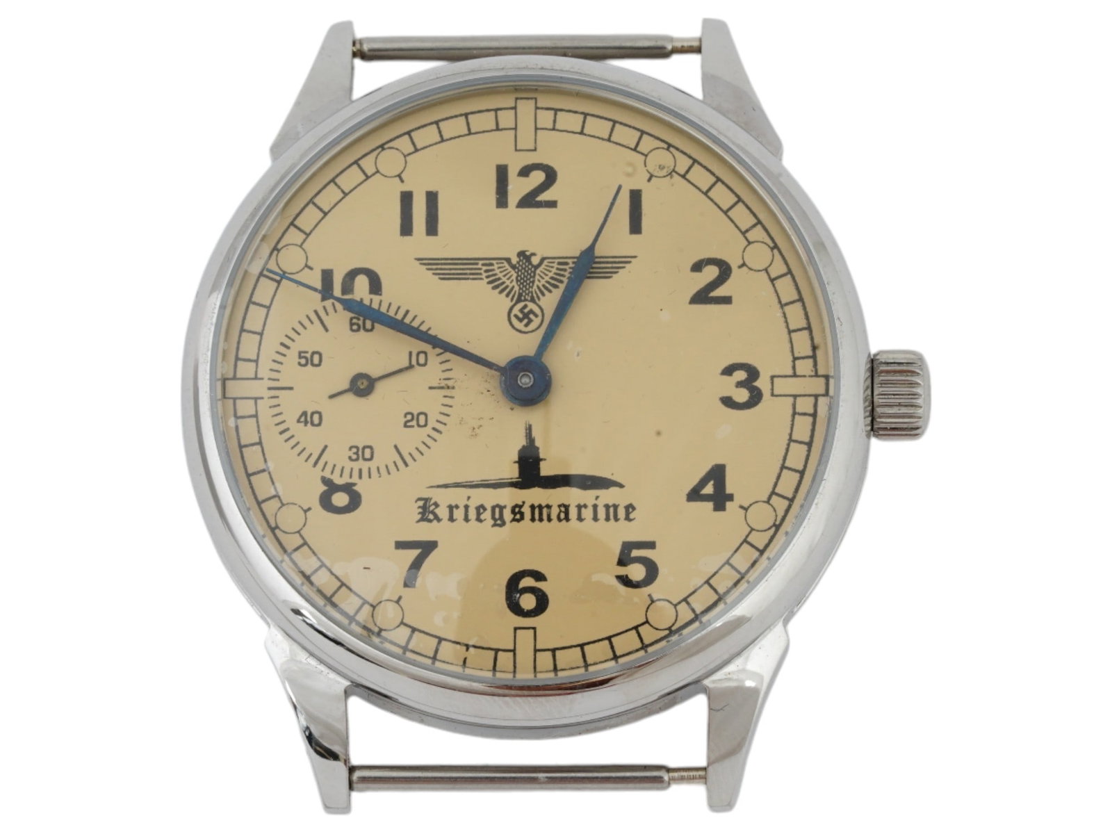WWII ERA NAZI GERMAN KRIEGSMARINE WRISTWATCH CASE: A World War II era German stainless steel wristwatch case. Polished bezel, single crown. Yellow dial with Reichsadler and U-boat, inscription Kriegsmarine, sub-dial, Arabic numerals. The backside reve