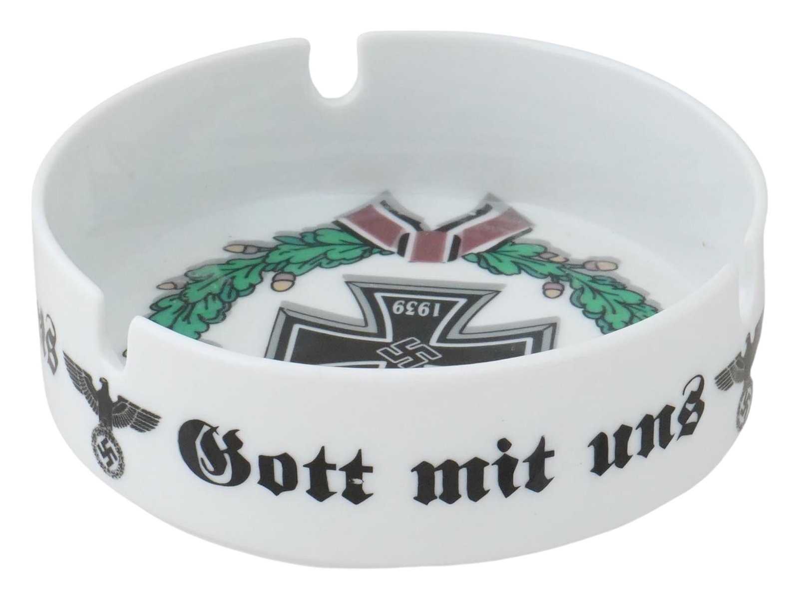 WWII GERMAN GOTT MIT UNS 1939 CERAMIC ASHTRAY: A WWII German white ceramic ashtray. Polychrome transfer printed decor, 1939 Iron Cross with swastika, oak wreath, Reichsadler, motto Gott Mit Uns, God is with Us. Crowned mark Heinrich, Selb Bavaria,