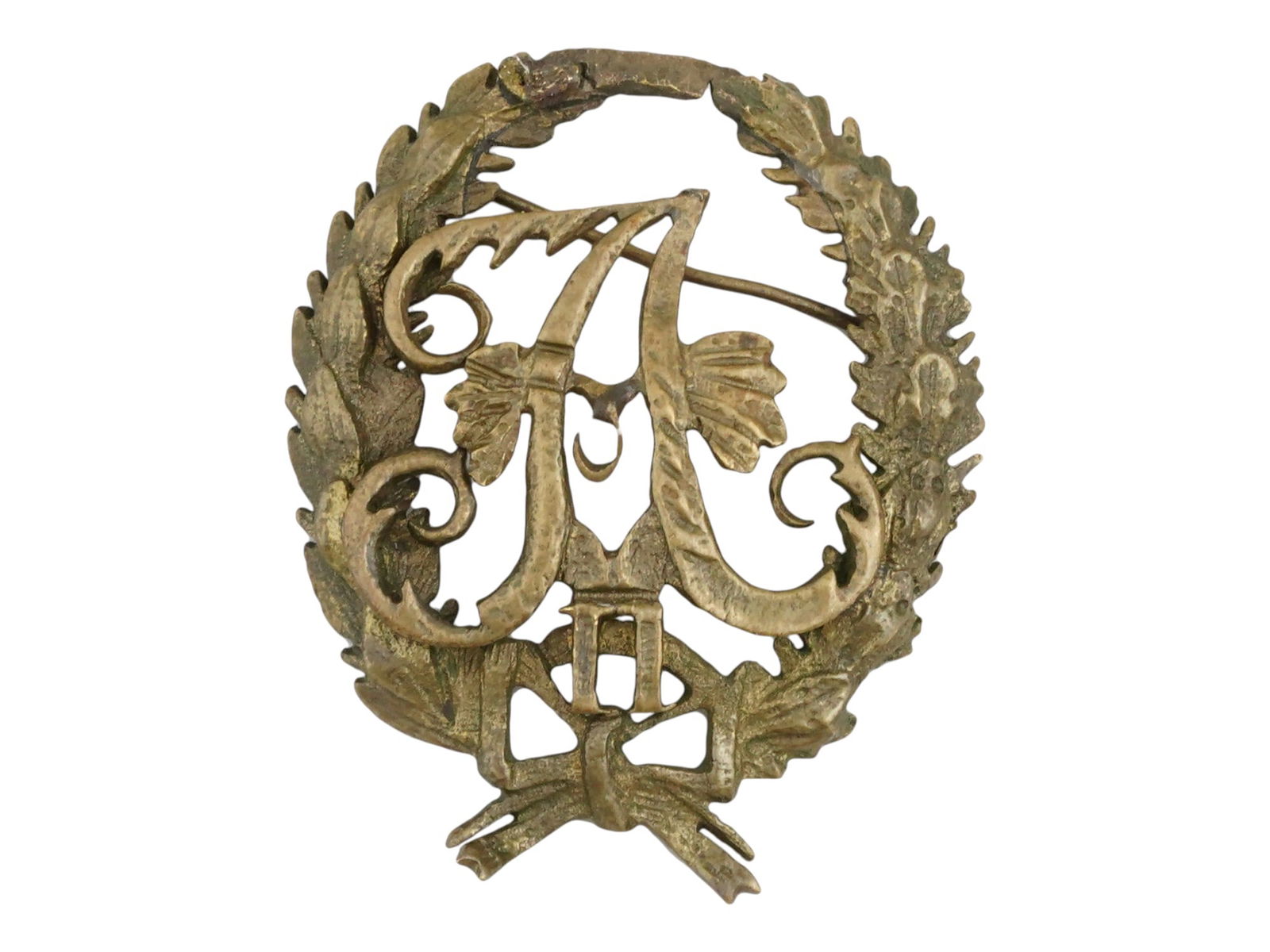 RUSSIAN IMPERIAL ALEXANDER II BRONZE MILITARY BADGE: A Russian Imperial bronze military badge issued for the ranks of His Majestys companies, squadrons, and batteries to commemorate the day of the death of Emperor Alexander II. The badge features the mo