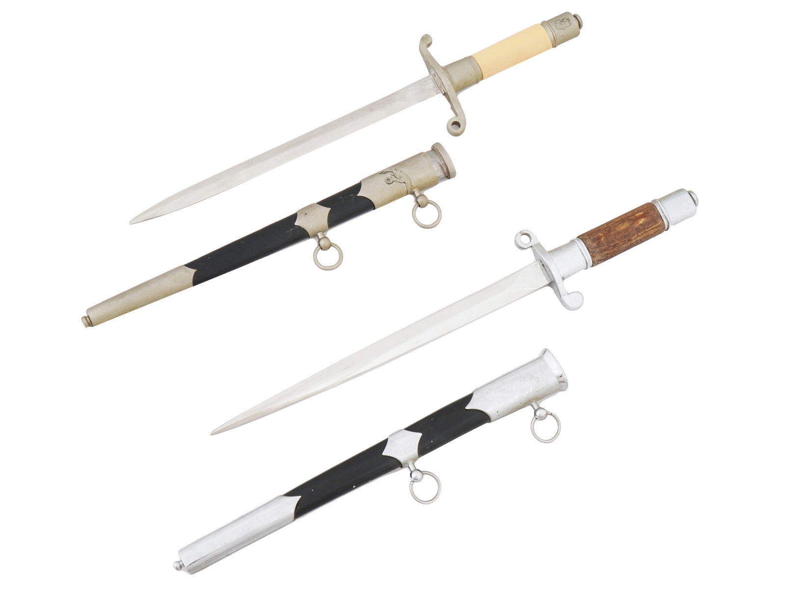 SOVIET ERA POLISH DRESS DAGGERS WITH SCABBARDS: Two Soviet-era Polish dress daggers. Each dagger features a straight, double-edged blade and a simulated stone-colored and wooden handle, and an S-shped crossguard. A lock button on the reverse of the
