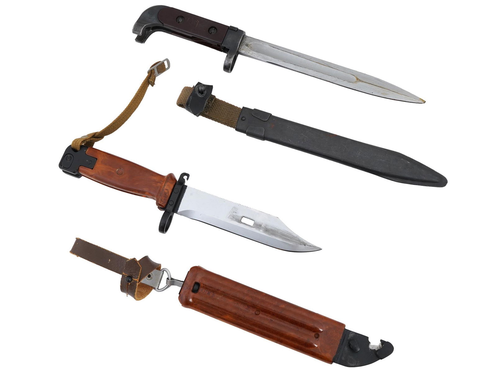 RUSSIAN SOVIET AKM AND AK47 ASSAULT RIFLE BAYONETS: A Russian Soviet 6H2 knife bayonet designed for use with the Kalashnikov AKM and AK74 assault rifles. The 6H2 bayonet features a steel blade with a distinct clip point and a serrated edge. It attaches