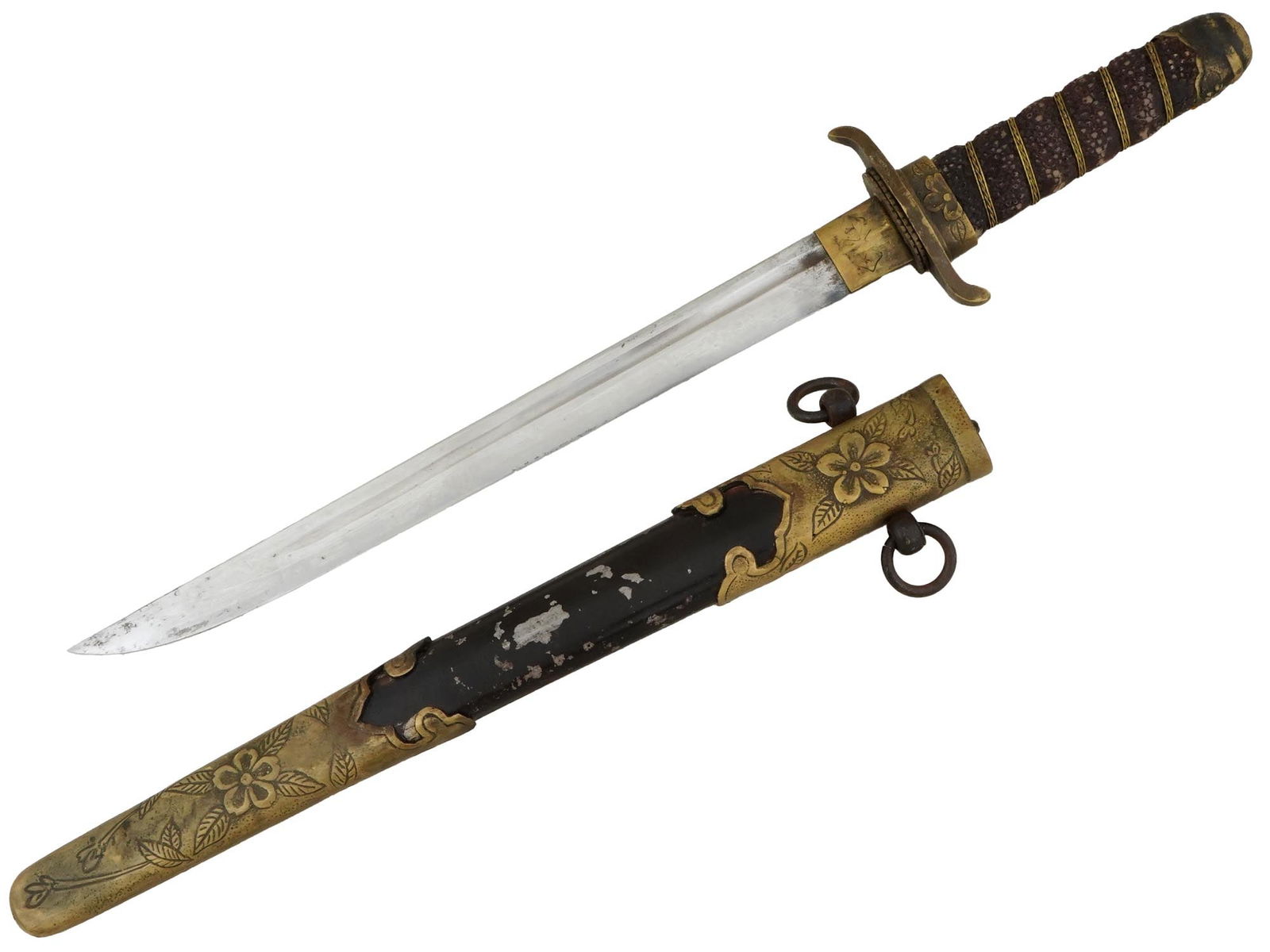 IMPERIAL JAPANESE NAVAL OFFICERS DAGGER WITH SCABBARD: An Imperial Japanese naval officers dagger featuring a tapering grip of faux skin with a brass wire binding. The brass pommel cap is adorned with a raised cherry blossom motif, while the brass crossgu