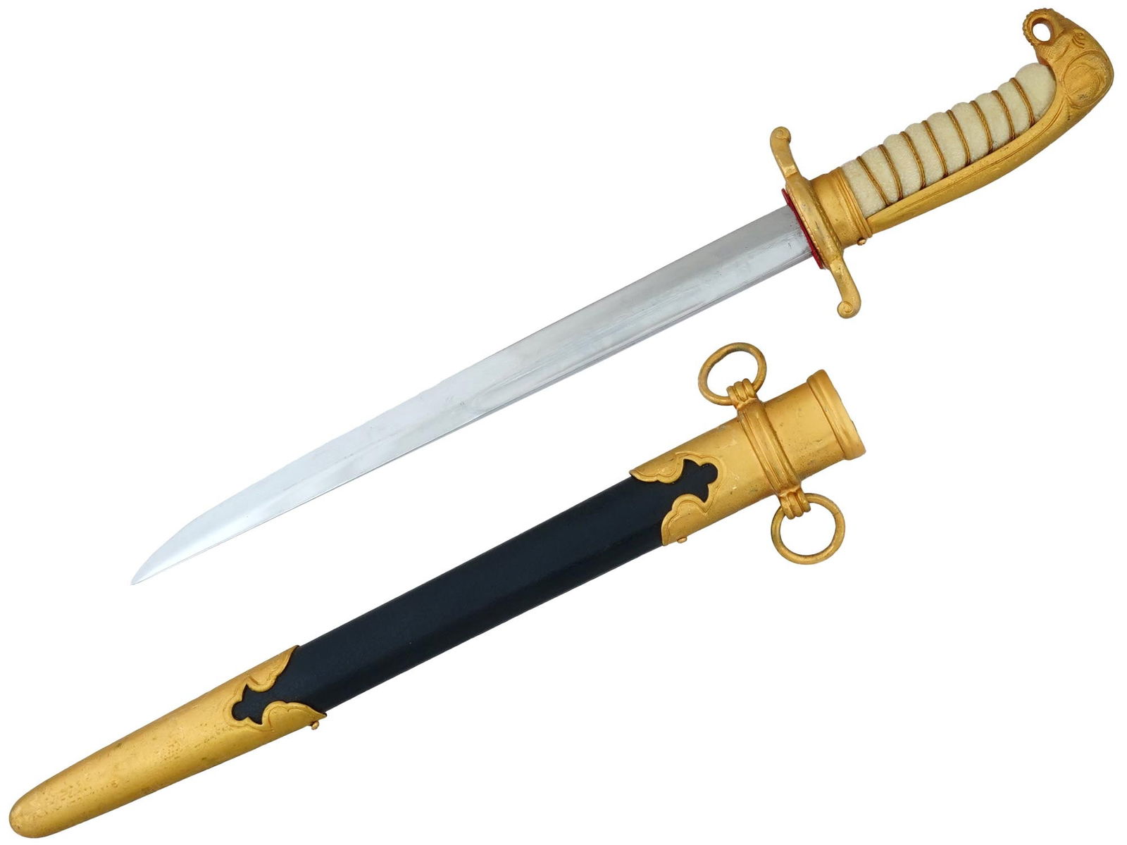 THAI ARMY OFFICERS ELEPHANT HEAD DAGGER: A Thai army officer elephant head dagger. The surface of the handle is imitating a shark skin, with transverse grooves, along which it is wrapped with twisted gilt brass wire. The head of the handle i