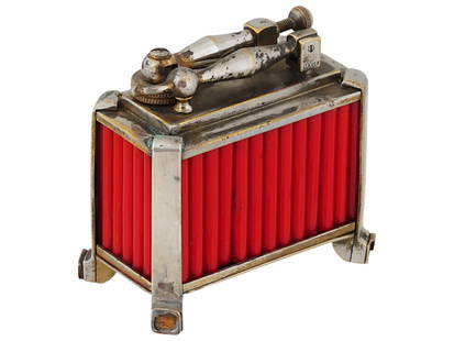 ART DECO STYLE DUNHILL TABLE TOP LIGHTER: A vintage table gas lighter by Dunhill. Footed metal piece with red fluted body, Art Deco style. Marked Dunhill Lighter on the bottom. Marked 75223 on the top. Collectible Tobacciana Accessories And C