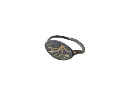 ANCIENT GREEK BRONZE ENGRAVED SIGNET RING 500 TO 200 BC: An ancient Greek bronze signet ring with an engraved pattern on the top featuring a leaping deer, circa 500 to 200 BC. Ancient Greek Jewelry and Historical Artifacts For Collectors. Dimensions: Size 3