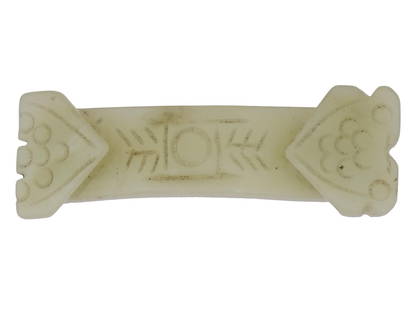 ANTIQUE CHINESE QING CARVED JADE BELT BUCKLE: An antique Chinese Qing dynasty celadon jade belt buckle is intricately hand carved with traditional patterns. Circa the late 19th or early 20th century. These buckles were used to secure the leather