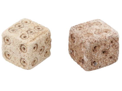 PAIR OF ANCIENT ROMAN STONE DICE 100 TO 300 AD: A pair of ancient Roman hand carved stone dice, ca. 100 to 300 AD. Crafted with precision and care, these artifacts offer a tangible connection to the everyday life and leisure activities of the past.