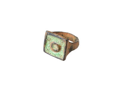ANCIENT ROMAN BRONZE RING WITH ENAMELED EVIL EYE IMAGE: An ancient Roman bronze ring dating from 100 to 300 AD. Features an enameled image of an eye on its square top, a symbol historically believed to ward off the evil eye and protect its wearer from harm