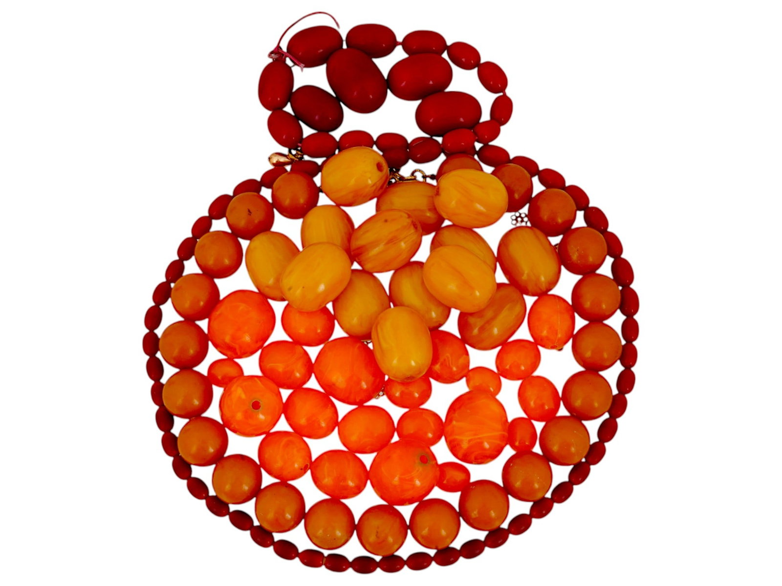 COLLECTION OF AMBER BEADS FOR JEWELRY DESIGNS: A collection of amber beads in various shapes and warm golden to honey hues. Some of the beads are already strung, while others are loose, offering versatility for jewelry making or collecting. Natura