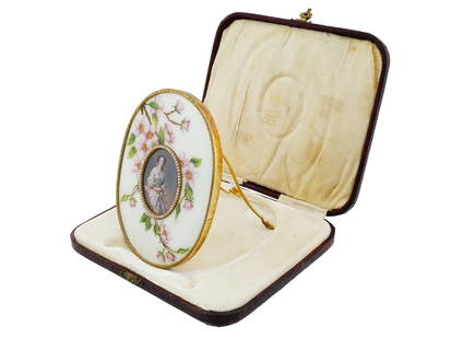 RUSSIAN SILVER ENAMEL NATURAL PEARLS PHOTO FRAME IOB: A Russian oval shaped 84 gilt Silver and enamel picture frame. The frame is covered with Guilloche enamel in white, pink, green and yellow shades, represents a sakura tree branch design, and encrusted