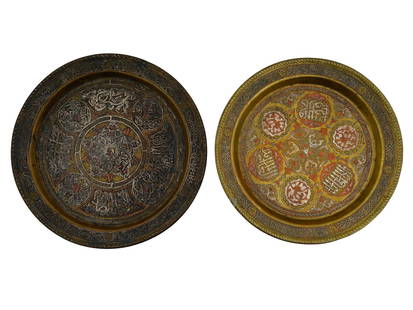 ANTIQUE PERSIAN ETCHED COPPER SERVING TRAYS: A pair of antique Persian serving trays. Late Qajar era, before 1925. Copper chargers with tinned accents, covered in etched Farsi calligraphy and geometrical ornaments. Collectible Oriental Middle Ea