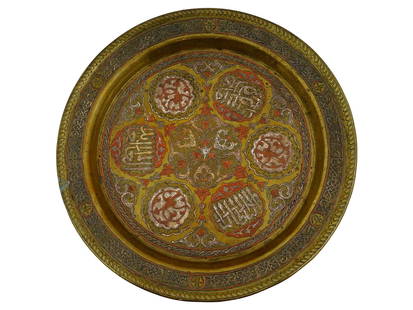 ANTIQUE PERSIAN ETCHED COPPER SERVING TRAY: An antique Persian serving tray. Late Qajar era, before 1925. Copper charger with tinned accents, covered in etched Farsi calligraphy and geometrical ornaments. Collectible Oriental Middle Eastern Met