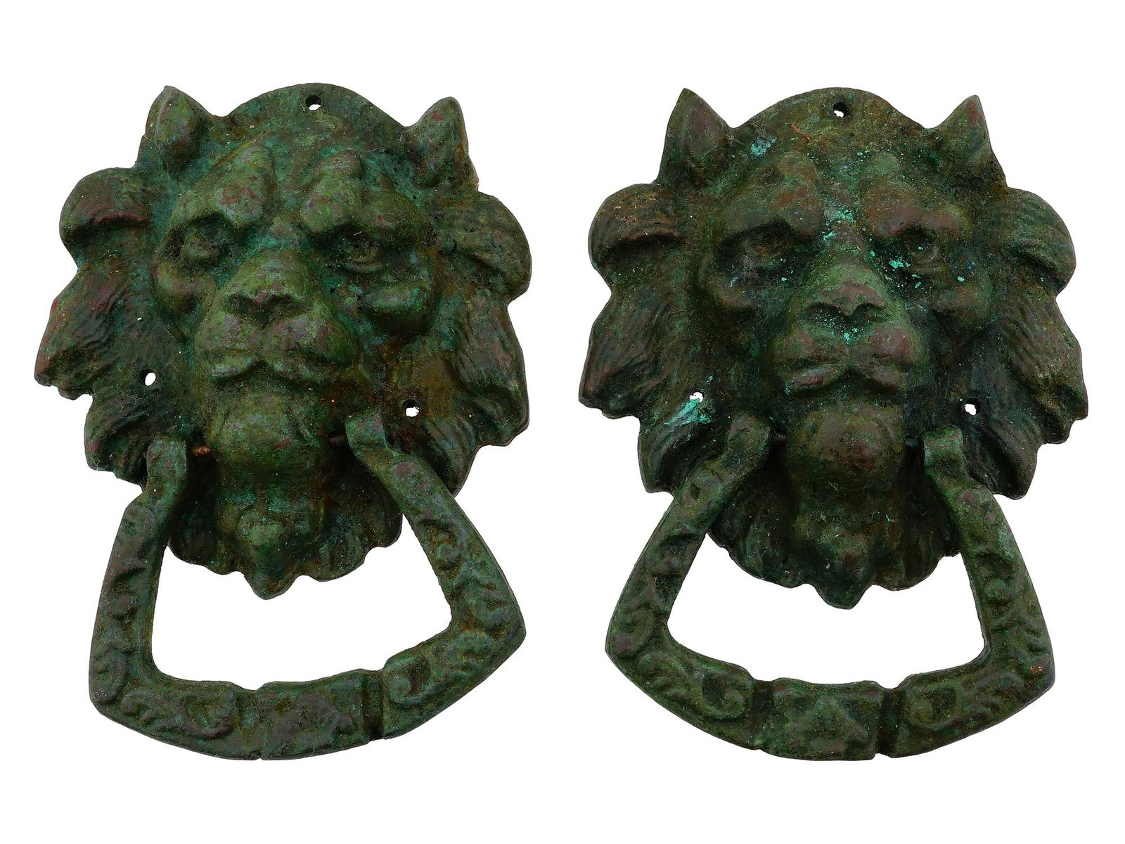 TWO ANCIENT ROMAN BRONZE LION DOOR KNOCKERS: A lot of two ancient Roman bronze door knockers in the form of lions heads. The lions heads have a stern muzzle, a wide mane and hold a door ring in the shape of a horses stirrup in their teeth. They 