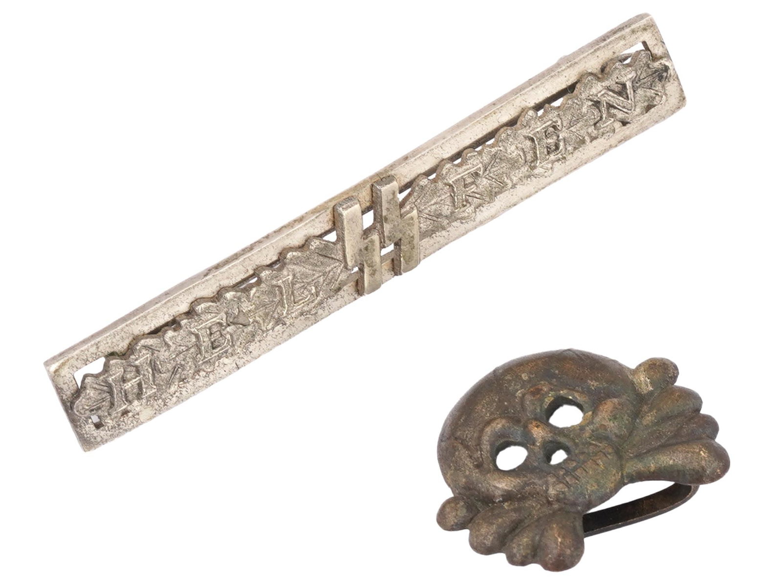 WWII GERMAN SS HELFER SILVER CLASP AND PANZER SKULL: A WWII Nazi German Waffen-SS Helfer silver clasp-badge, awarded for faithful service, typically to members of the Waffen-SS who exhibited special diligence and devotion to duty. The badge is marked wi