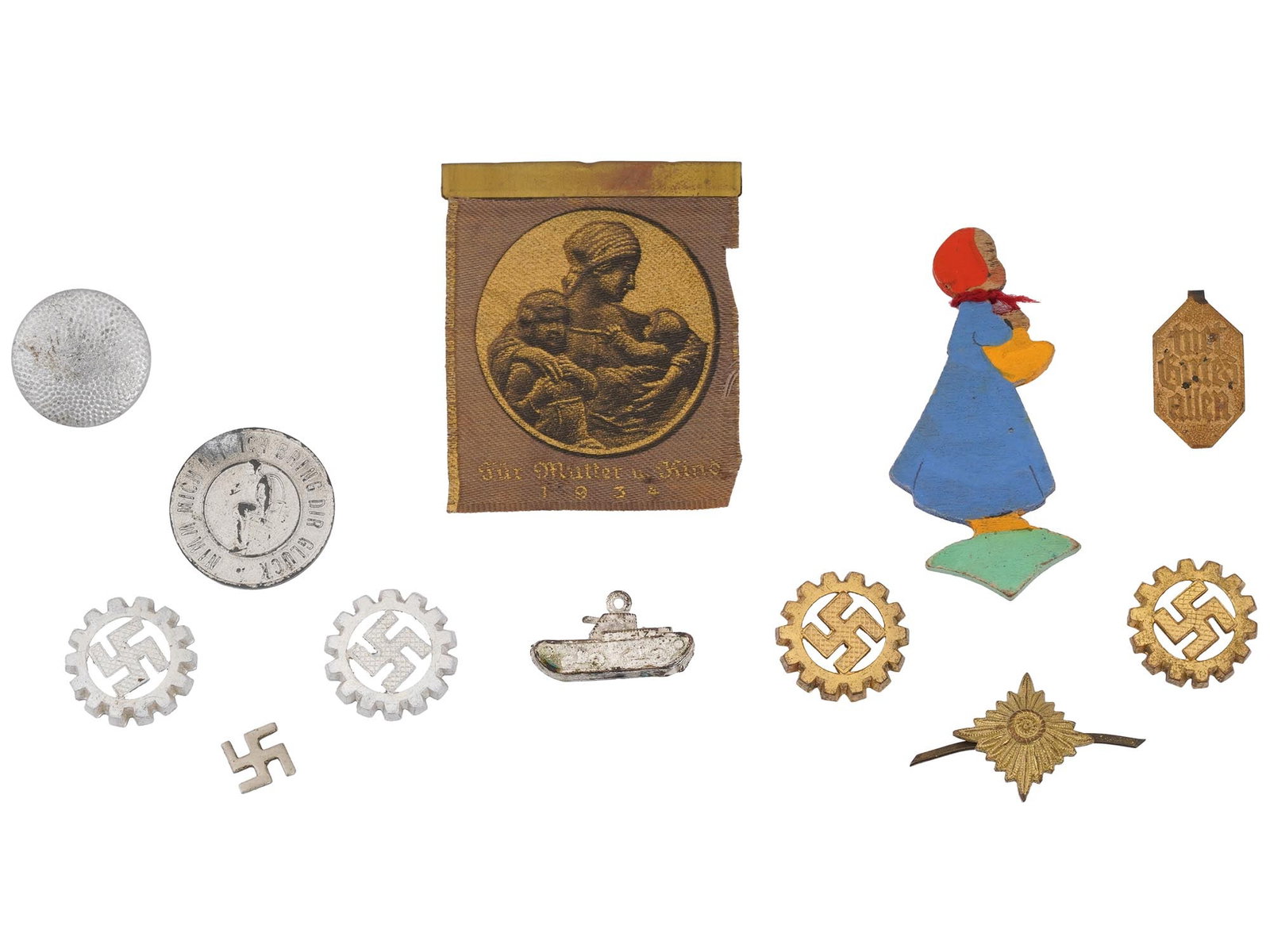 WWII NAZI GERMAN LABOR FRONT PINS AND COLLECTIBLES: A collection of Nazi German Labor Front Deutsche Arbeitsfront collectibles, including various pins prominently featuring the cogwheel design encircling the swastika emblem. The lot also includes a Win