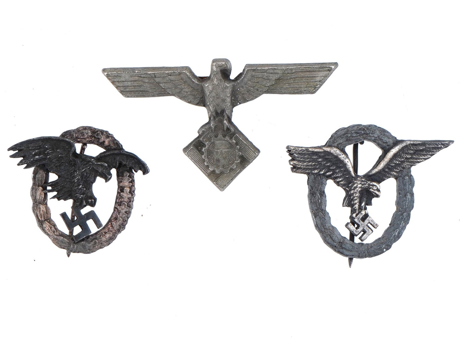 THREE WWII GERMAN BADGES INCL LUFTWAFFE PILOT AND TENO: A lot of three WWII German badges including two Luftwaffe Pilot Observer Badges and an SS Technische Nothilfe or Technical Emergency Help badge with eagle for the Officer Visor Cap. Second World War N