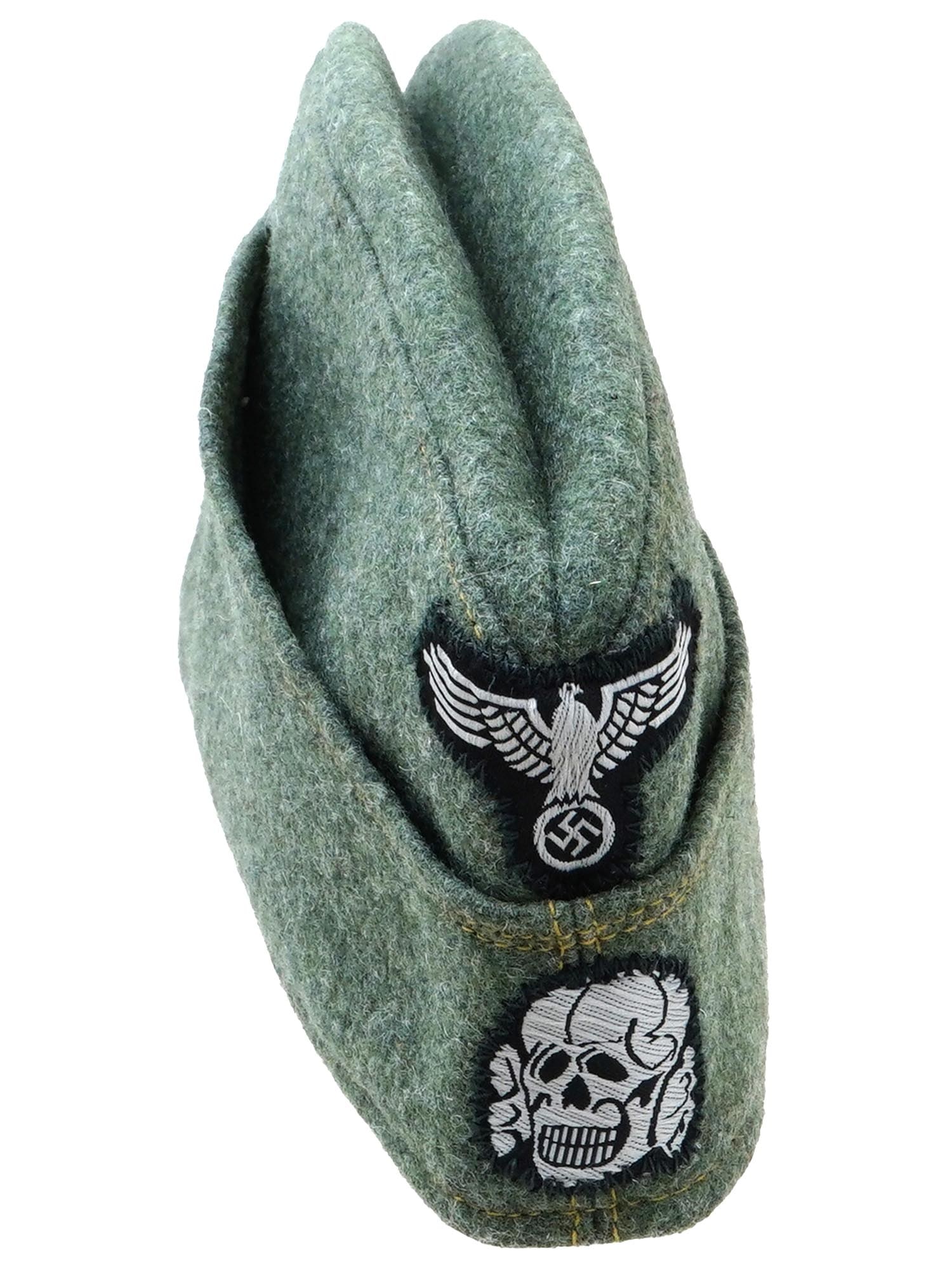 WWII NAZI GERMAN SS TOTENKOPF OVERSEAS CAP: A World War II German EM SS overseas cap. Green wool narrow hat that could be folded flat and tucked into a belt or haversack. The front bears a complete set of SS insignia, with a Totenkopf below an 