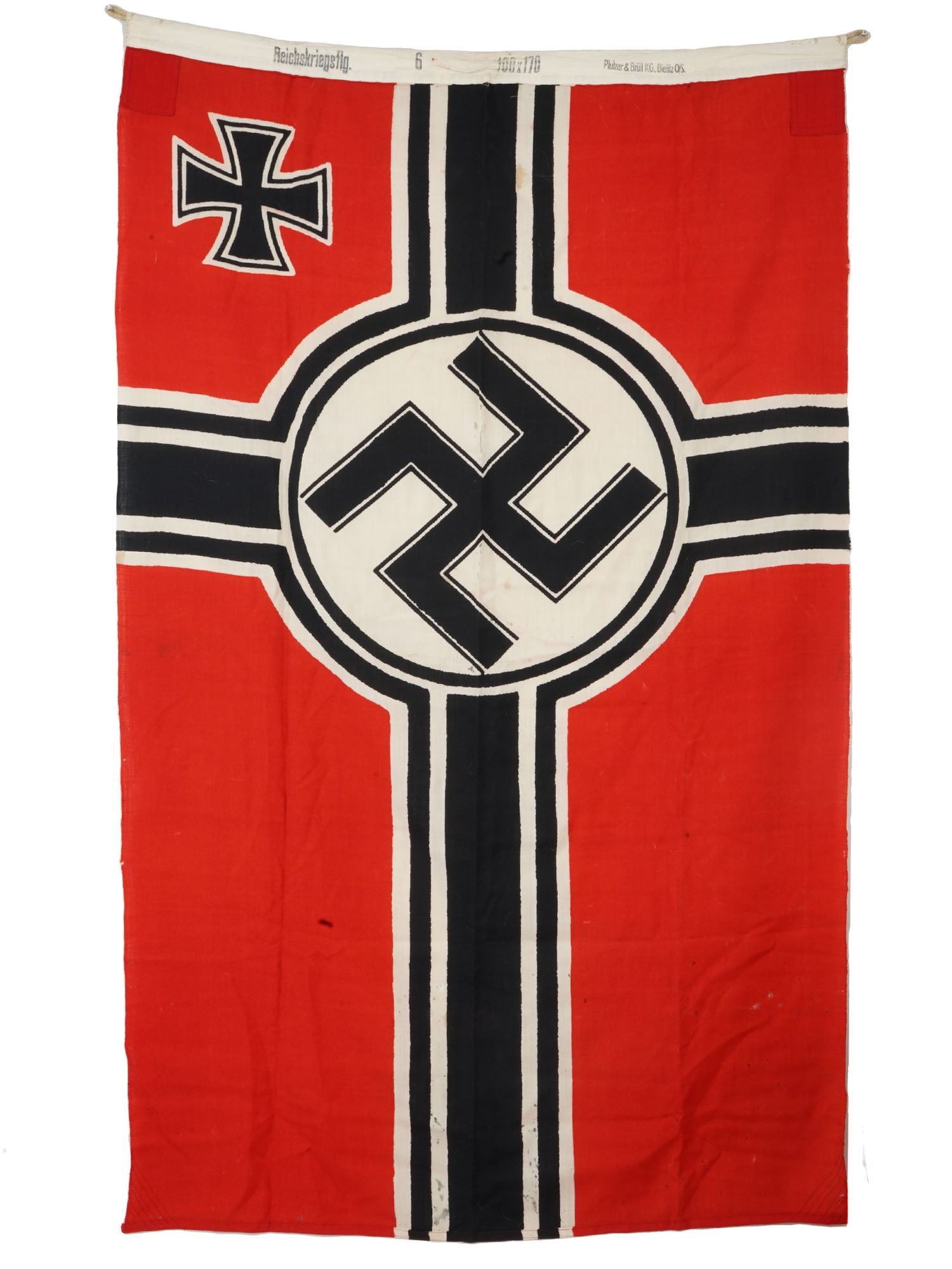 GERMAN WWII MILITARY BATTLE FLAG: A World War II Nazi German fabric flag with swastika and Iron Cross. Marked Reichskriegsflagge, Imperial War Flag, Plutzar und Brull KG Bielitz OS on the rim. Second World War Historical Collectables 