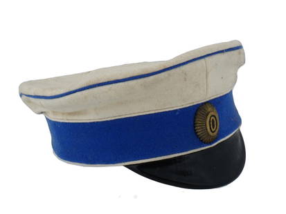 RUSSIAN CIVIL WAR PRIVATES HAT WITH IMPERIAL BADGE: A 1919 Russian Civil War privates hat or visor cap, 1st Officer General Markov Regiment. White and blue wool, black leather, Imperial badge on the front. Hallmark on the inside. Historical Collectible