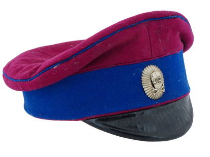 RUSSIAN CIVIL WAR OFFICERS HAT WITH SKULL BADGE: A 1919 Russian Civil War Officers hat or visor cap, Volunteer Army of Mikhail Drozdovsky. Blue and red wool, black leather, skull badge on the front. Hallmark on the inside. Historical Collectibles An
