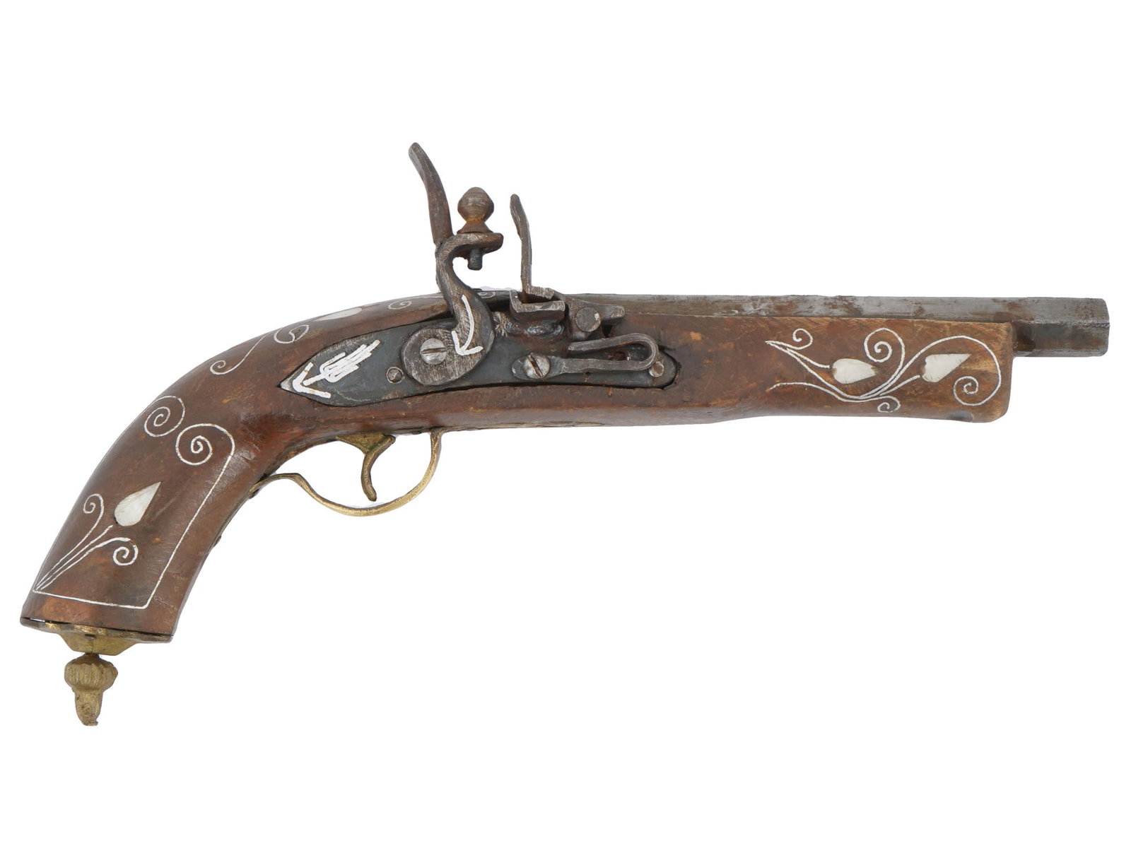 PERSIAN QAJAR FLINTLOCK PISTOL WITH NACRE INLAY: An antique Indo-Persian single-barrel flintlock pistol made of iron and wood. Qajar period, 1795 to 1925. The handle has a knob finial. The piece is richly decorated with ornaments and mother-of-pearl
