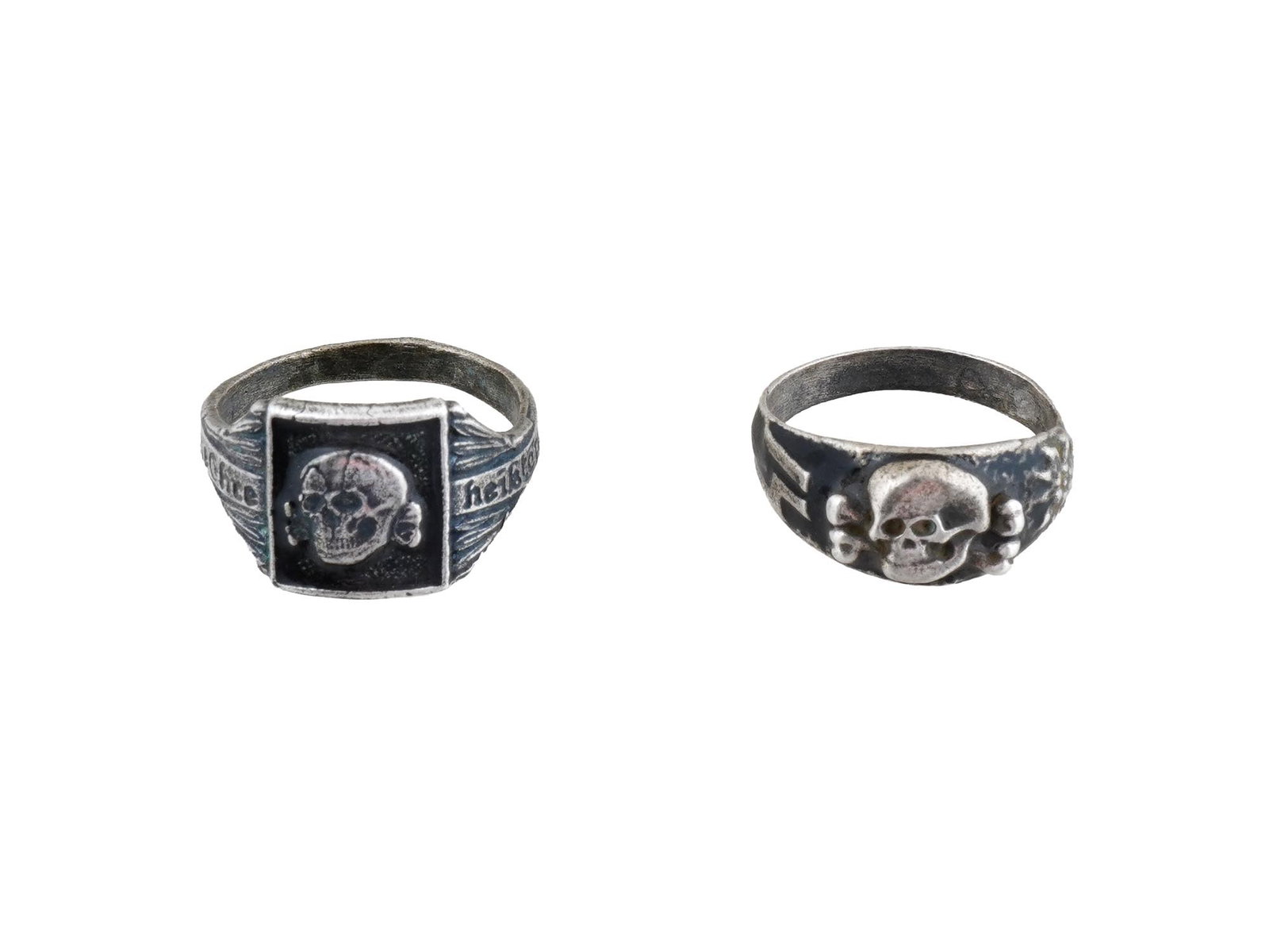 LOT OF TWO WWII TYPE GERMAN NAZI WAFFEN SS SILVER RINGS: A lot of two WWII type Nazi German Waffen SS silver rings: Waffen SS Mountain Troops and Waffen SS division Totenkopf. The exterior of the Mountain troops ring is engraved with a Totenkopf skull swast