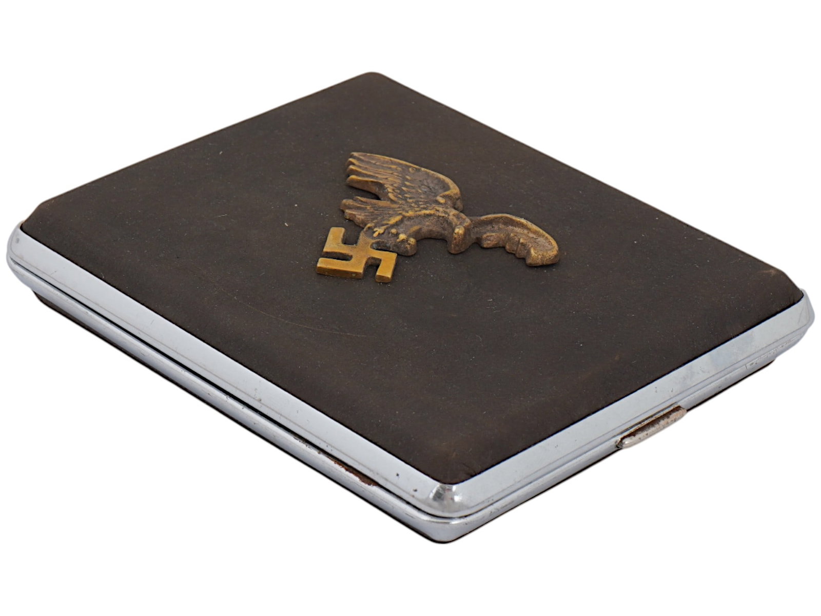 WWII NAZI GERMAN LUFTWAFFE PILOTS CIGARETTE CASE: A WWII Nazi German Luftwaffe pilots cigarette case, featuring a raised relief image of the Luftwaffe eagle with outstretched wings clutching a swastika, centered on the hinged lid. Combines functional