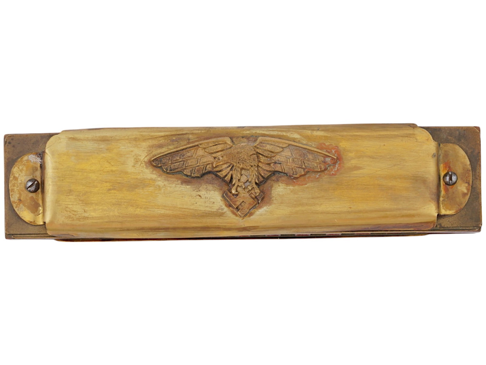 GERMAN WWII LUFTWAFFE PILOTS HARMONICA: A World War II type Nazi German Luftwaffe pilots brass harmonica. Eagle with swastika on the obverse, swastika and date 1938 on the reverse. World War II Historical Collectibles And Memorabilia, Music