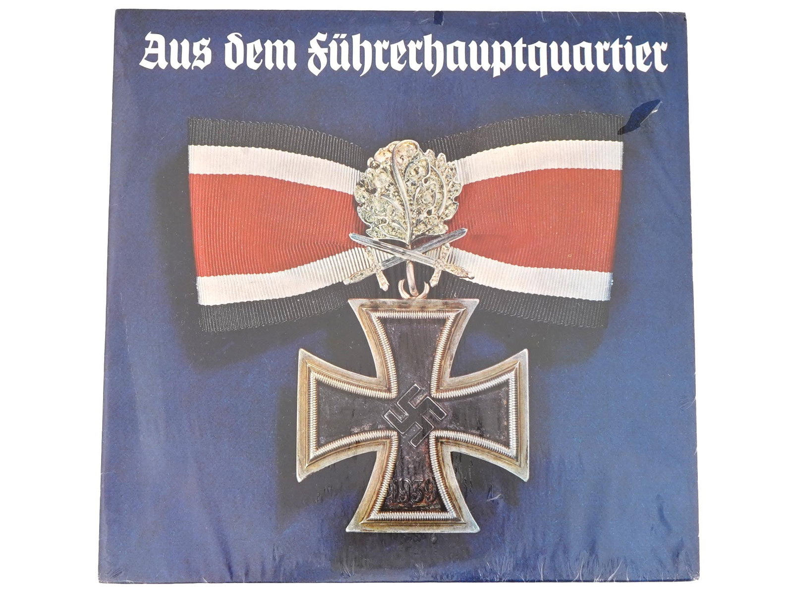 WWII NAZI GERMAN WEHRMACHT REPORTS LP MUSIC RECORD: A vintage, 1971, American sealed documentary WWII Nazi German Wehrmacht Reports LP music record Aus Dem Fuhrerhauptquartier. The music record includes parts 1 and 2. The cover features the German Iron