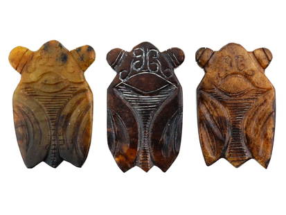 LOT OF ASIAN HAND CARVED JADE SCULPTURAL AMULETS: A lot of three Asian hand carved Jade amulets. The amulets represent a mythological figure, engraved with detailed patterns. Antique and Vintage Asian and Oriental Carved Natural Stone Figures, Amulet