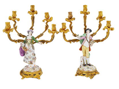ANTIQUE 19TH C GERMAN MEISSEN PORCELAIN CANDELABRA: A pair of antique German Meissen gilt bronze and porcelain five light candelabras. Circa the late 19th century. The pieces feature hand painted figures of a lady and gentleman dressed in the French fa
