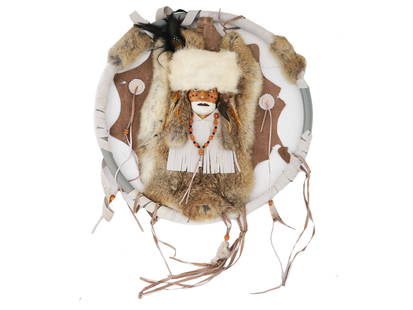 SOUTHWESTERN TRIBAL CHIEF CHEROKEE DREAM CATCHER: A Southwestern Chief Cherokee Dream Catcher. The ware is made of various materials including leather, fur, feathers, and others. The dream catcher is adorned with a sculptural bust of a tribal chief w