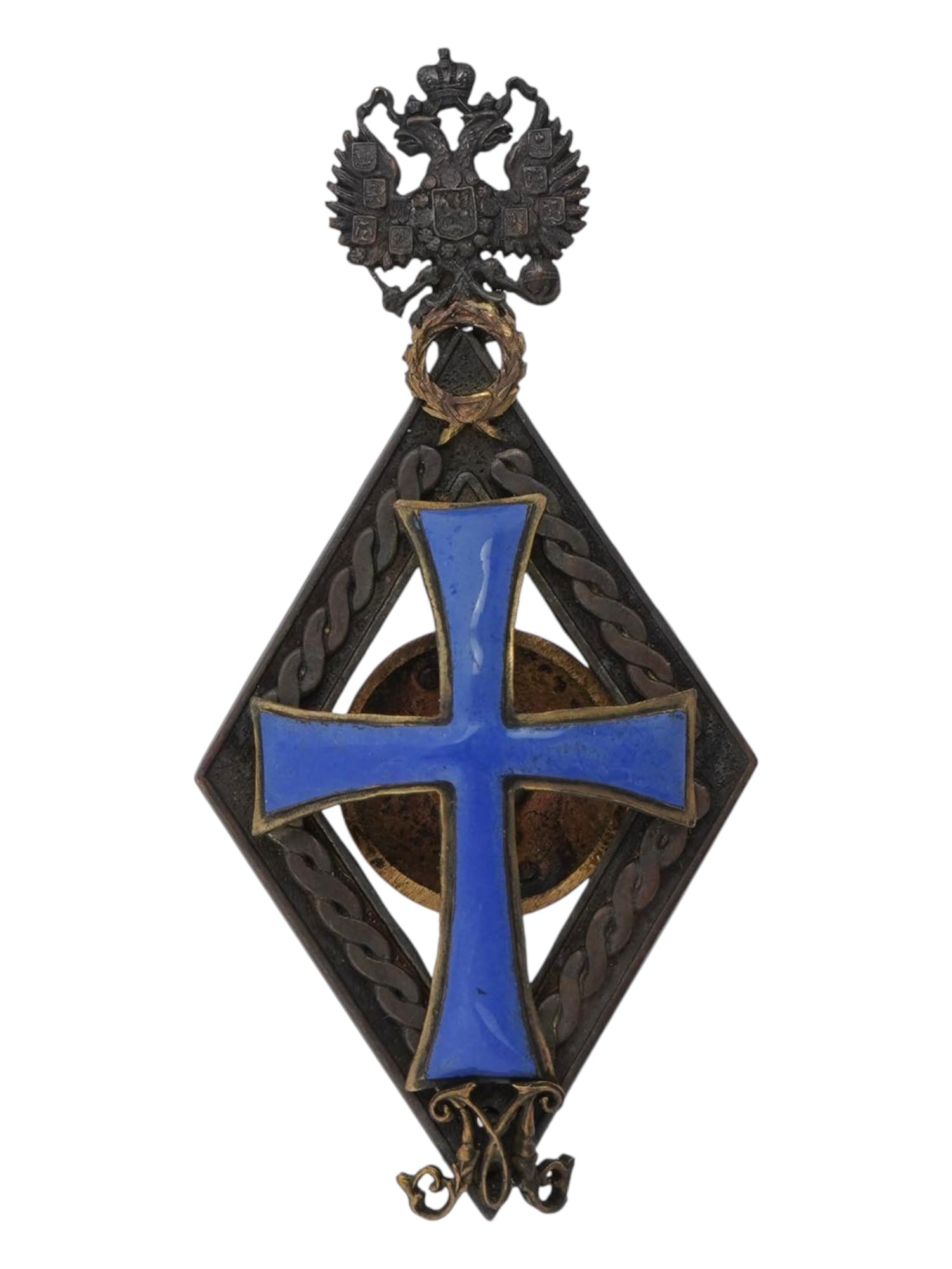 IMPERIAL RUSSIAN BRONZE ENAMEL ACADEMIC AWARD BADGE: An Imperial Russian enameled bronze award badge, for for persons awarded the academic title of Master of Russian Universities in 1899-1903. Rhombus with a Christian cross, letter M for Master below, l