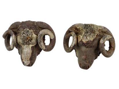ANCIENT ROMAN BRONZE RAM HEADS DECORATION: A lot of two decorations made of Ancient Roman bronze vessels shaped as ram heads. Late Imperial period, ca. 4th to 6th century AD. Well detailed, with horns spiraling forward. Hollow inside. Total we