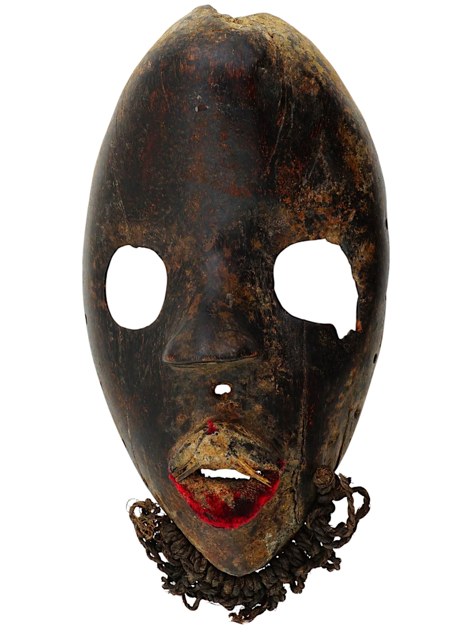 AFRICAN CARVED WOOD MANDE TRIBAL DAN MASK: An African hand carved wood tribal mask of the Dan people, a Mande ethnic group from northwestern Ivory Coast and neighboring Liberia. They are officially known as Yacouba in Ivory Coast. The oval fac