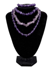 SEVERAL STRANDS OF IRREGULARLY SHAPED AMETHYST BEADS