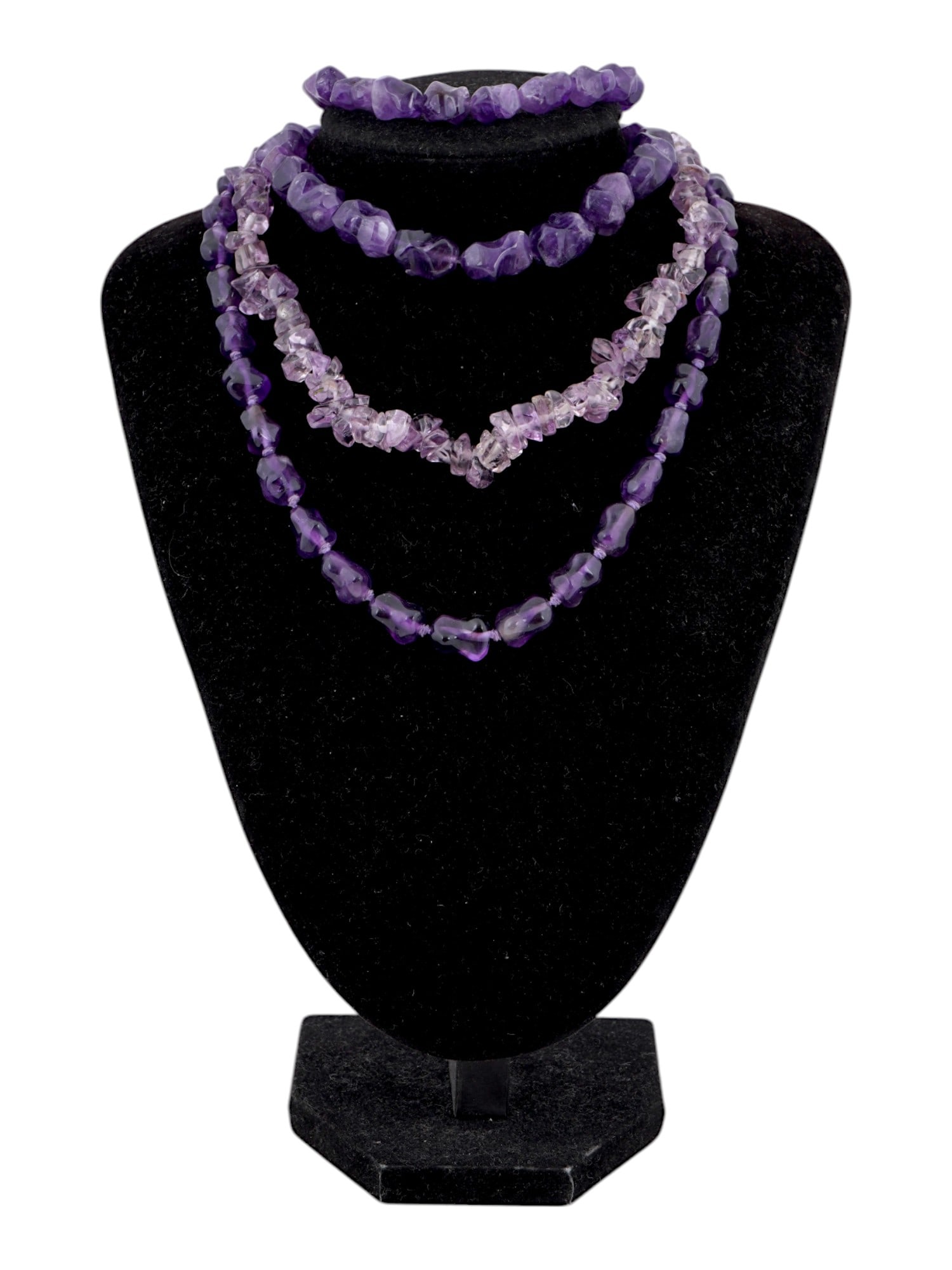 SEVERAL STRANDS OF IRREGULARLY SHAPED AMETHYST BEADS: A several strands of irregularly shaped amethyst beads. The amethyst beads vary in size, shape, and color intensity, ranging from deep purple to pale lavender. Vintage and Modern Natural Stones, Neckl