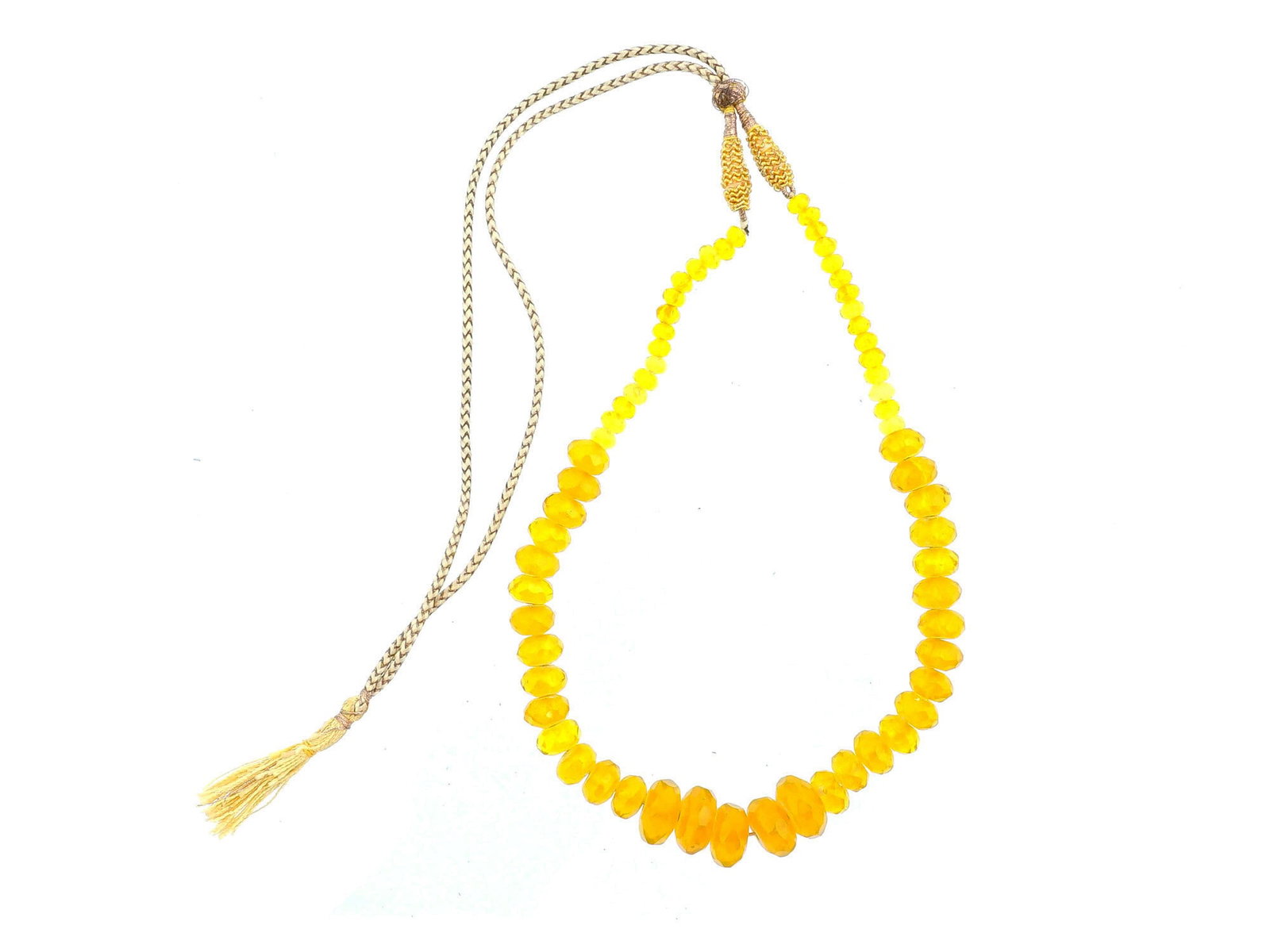 VINTAGE ASIAN ORIENTAL BEADED YELLOW NECKLACE: A vintage Asian oriental beaded yellow necklace. Probably of Indian origin. The necklace consists of a braided cord with a tassel at the end and faceted beads of different sizes. Costume Jewelry, Gift