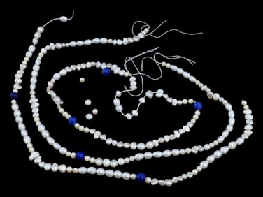 THREE STRINGS OF SMALL NATURAL BAROQUE PEARL BEADS