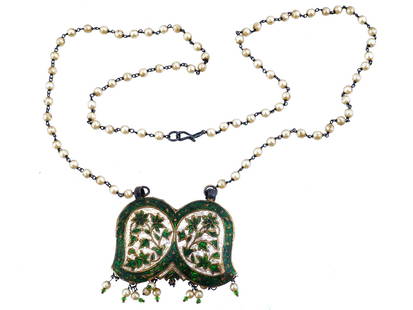 VINTAGE SILVER ENAMEL BEADED PENDANT NECKLACE: A vintage silver enamel beaded pendant necklace. The necklace consists of white mother of pearl beads and a silver chain with a hook clasp. The pendant in the form of wings is covered with white, gold