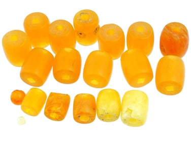 GROUP OF HAND CARVED NATURAL AMBER JEWELRY BEADS
