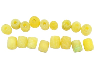 GROUP OF HAND CARVED NATURAL AMBER JEWELRY BEADS