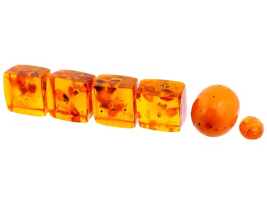 GROUP OF HAND CARVED NATURAL AMBER JEWELRY BEADS